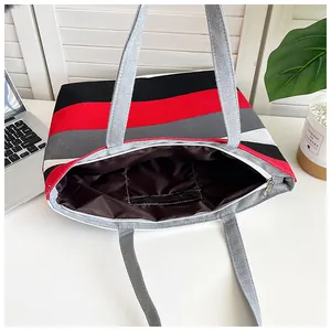 Detailed macro view showing the internal structure of this striped canvas tote bag