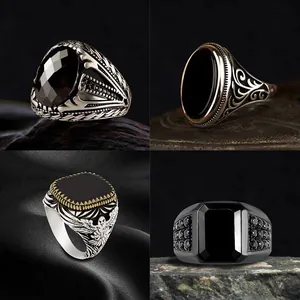 Collection of vintage men's rings featuring black stones and intricate engraved patterns