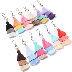 Detailed view of colorful three-layer cotton tassels with silver metal lobster clasps