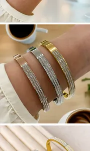 Detail of gold, silver, and rose gold stainless steel bracelets with rhinestones
