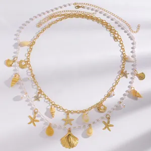 Detail view of Bohemian body chain with starfish, seashells and pearls for beach fashion