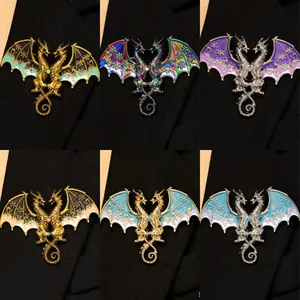 Detailed view of six colors of fantasy two-headed dragon brooches with snowflake wings