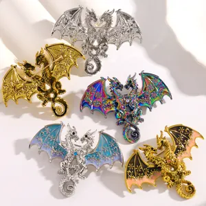 Close-up of five double-headed dragon brooches with intricate wing patterns