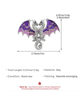 Detailed view of fantasy double-headed dragon brooch with purple wings and snowflake pattern
