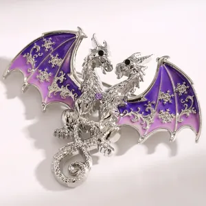 Detailed macro view of fantasy double-headed dragon brooch with purple snowflake wings
