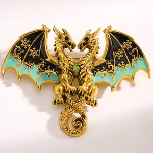 Detailed macro view of fantasy double-headed dragon brooch with golden snowflake patterns