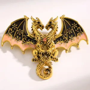 Macro view of fantasy double-headed dragon brooch with golden metal and colorful enamel wings