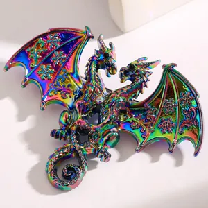 Close-up detail of a double-headed dragon brooch with iridescent plating and snowflake wings
