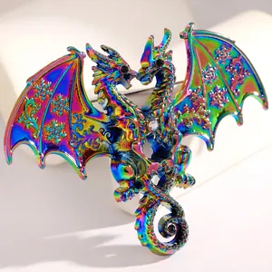Close-up of iridescent double-headed dragon brooch with snowflake pattern detail