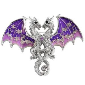 Detailed view of a silver double-headed dragon brooch with purple wings