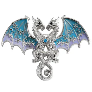 Detailed close-up of fantasy silver double-headed dragon brooch with blue snowflake wings