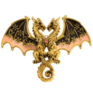 Macro detail of a golden double-headed dragon brooch featuring snowflake enamel wings.