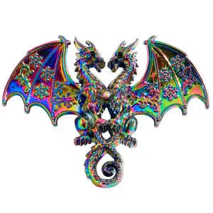 Close-up of rainbow iridescent double-headed dragon brooch with snowflake wings