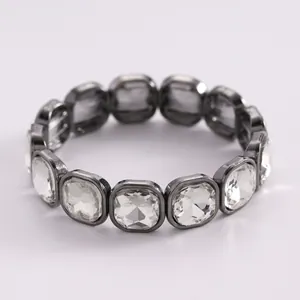 Elegant bracelet featuring oversized clear acrylic crystals in dark metal frames.