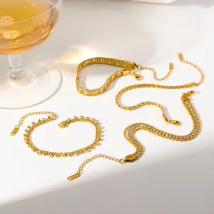 Detailed shot of stackable gold-plated stainless steel bracelets with sparkling zirconia stones