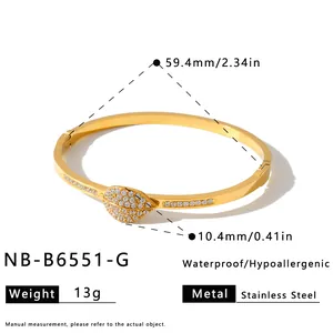 Detailed view of gold stainless steel leaf bangle with rhinestone embellishments