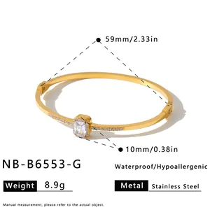 Detail view of gold stainless steel bangle with zircon and rhinestone inlay