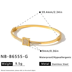 Detailed view of gold stainless steel bangle showing dimensions and hypoallergenic specs