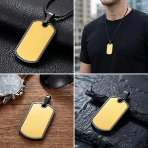 Detailed macro view of matte gold and black stainless steel dog tag pendant for men.