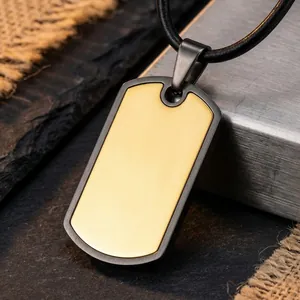 Macro detail of customizable men's dog tag necklace pendant with gold and gunmetal finish