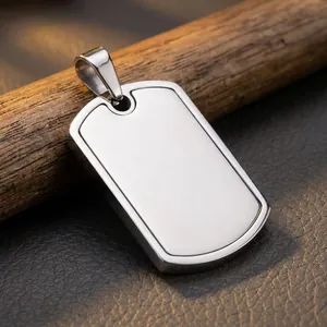 Detailed macro view of a blank stainless steel dog tag pendant on a rustic wooden background.