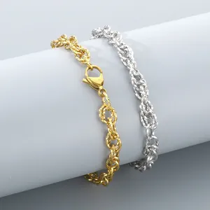 Close-up of elegant gold and silver stainless steel twisted double woven chain bracelets