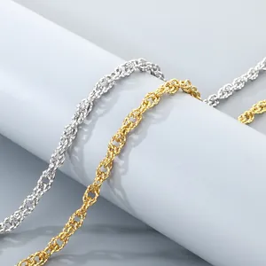 Close-up of gold and silver double woven twisted stainless steel chains