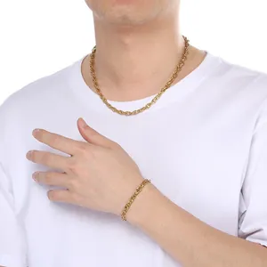 Detailed view of gold twisted double-woven chain necklace and bracelet set on model