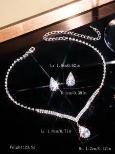 Close-up of sparkling zircon bridal jewelry set showing precise pendant and earring sizes.