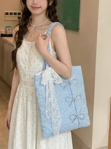 Elegant 2025 summer sequin bow canvas tote bag carried by a model in soft light