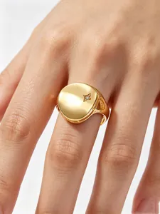 Detailed macro view of a gold-plated S925 sterling silver signet ring with a star