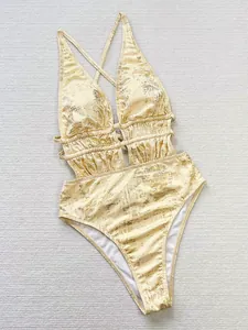 Elegant metallic gold one-piece swimsuit with a deep V-neck and side cut-out details.