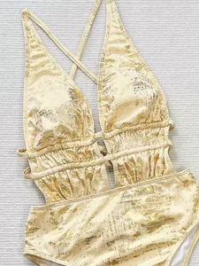Sexy gold metallic textured one-piece swimsuit with deep V-neck and cut-out details