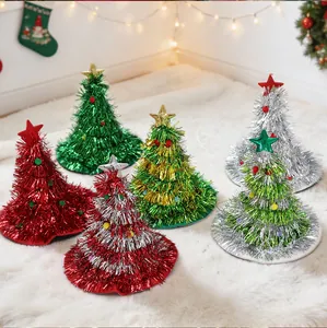 Diverse set of colorful tinsel Christmas tree party hats on white decorative rug