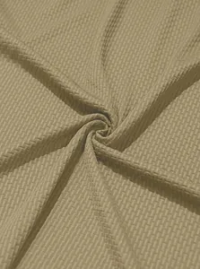 Macro detail view of high-quality breathable waffle knit fabric for men's polo shirts