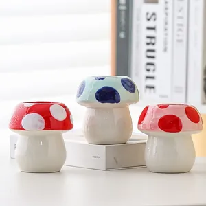 Three cute mushroom-shaped ceramic pencil holders for desktop storage and decor