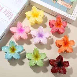 Vibrant set of eight colorful plumeria flower hair claw clips for elegant women's styling