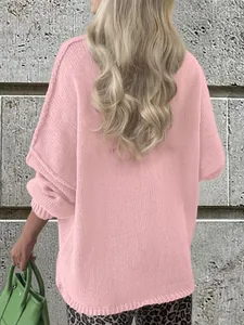 Casual pink oversized knit sweater for women with long sleeves and drop shoulder.