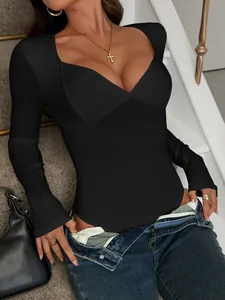 Detailed view of women's black ribbed long-sleeve bodysuit featuring a sexy sweetheart neckline