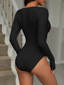 Elegant black solid Y2K long sleeve bodysuit for women shown in a back view pose