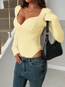 Detailed visual of a yellow Y2K style slim fit long-sleeve bodysuit for women wear