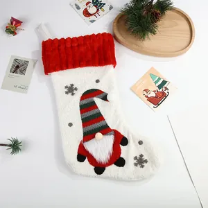 Large plush Christmas stocking with cute cartoon gnome design and snowflake embroidery detail