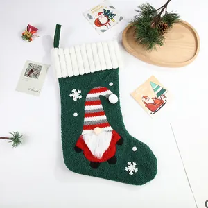 Large green Christmas stocking with a cute gnome and faux-fur cuff for gifts