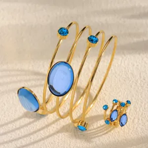 Exquisite French style gold spiral bracelet and matching ring set with blue gemstones