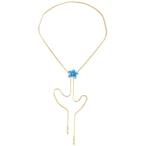 Close-up of golden Y-necklace featuring a blue enamel flower pendant with adjustable chain