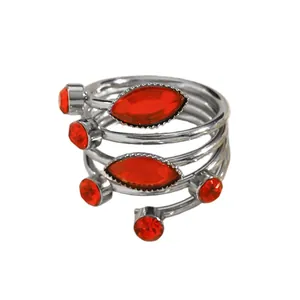 Detailed view of red marquise rhinestones on a silver-tone multi-layered wrap ring.
