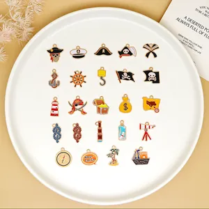 Collection of various pirate-themed enamel charms including skull, compass, and anchor