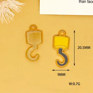 Macro detail view of alloy crane hook charms showing dimensions and weight specifications