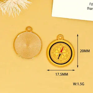 Detail of yellow enamel compass charm with size measurements 20mm by 17.5mm