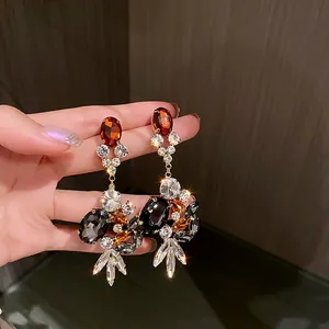 Vintage palace style drop earrings with multi-colored gemstones and floral fringe